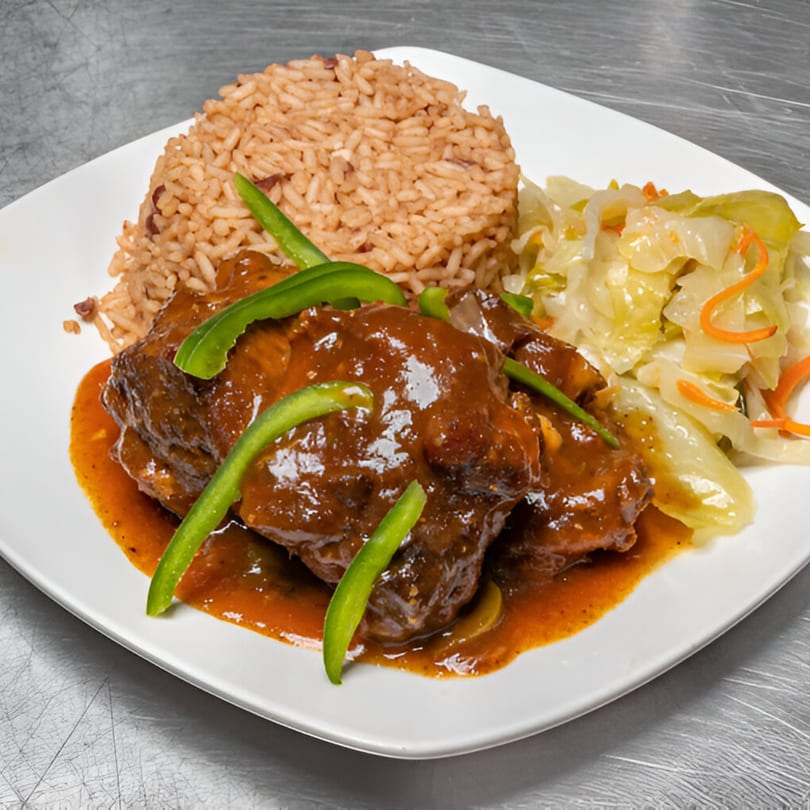 Andreas Caribbean & Seafood Restaurant's Jamaican stewed chicken with rice and peas, and steamed cabbage.